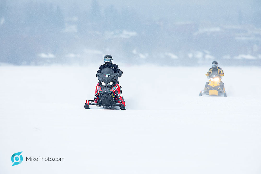 2 snowmobilers at probably 50-60km/h